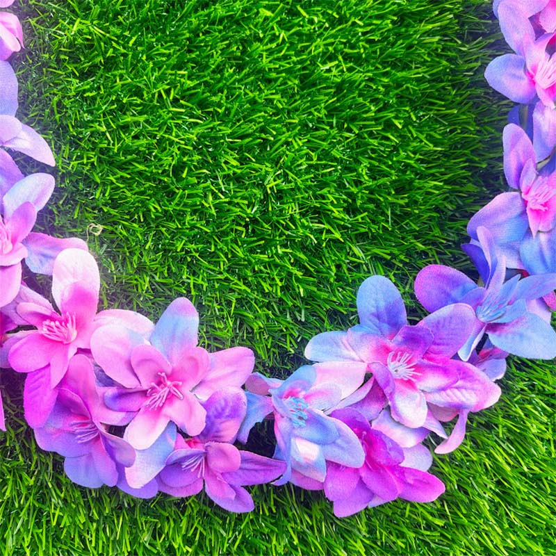 Artificial orchid garland with shades of purple and light blue flowers